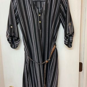Fall black stripe dress with offset brown belt.